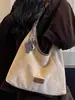 Bolso tote grande de estilo coreano minimalista nuevo 2026, moderno y elegante, adecuado para uso casual y para ir al trabajo, se puede llevar como bolso de hombro o bolso cruzado.