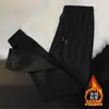 Pantalones deportivos casuales holgados para hombre, nuevos y modernos, forrados de polar para invierno, con bolsillos, cremallera, estilo jogger, pantalones de chándal largos rectos