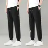 Pantalones deportivos jogger negros de pierna recta para hombre, nuevo estilo de otoño, holgados, a la moda, modernos, adecuados para correr, uso casual y para ir al trabajo.