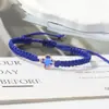 Pulsera tejida de nudo plano de trébol de cuatro hojas de venta caliente transfronteriza para parejas y estudiantes, tendencia europea y americana inspirada en la dopamina, joyería al por mayor de fabricante