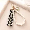 Llavero de Perlas Pequeñas Frescas Simple Hecho en Fábrica Pulsera de Perlas con Cinta Creativa Colgante para Bolso Coche