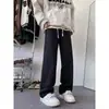 Pantalones de estilo retro americano para hombre, adecuados para primavera y otoño, con un diseño de moda de alta costura, un aspecto lavado y desgastado, y un acabado de mezclilla teñido en barro amarillo.