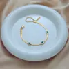 Pulseira de colar de aço de titânio transfronteiriço europeu e americano Olho do diabo de luxo leve simples para todos os jogos Corrente de osso de cobra feminina Jóias sem cor