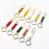 Nuevo llavero de flor de ciruelo con hebilla de resorte floral de cuero, colgante para bolso, accesorio DIY de superventas transfronterizo para parejas