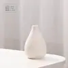 Cerámica de gres blanco liso para quemar en seco, jarrón creativo para flores, decoración simple de escritorio para el hogar, jarrón pequeño decorativo cerámico nórdico