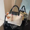Bolsa tote estilo coreano para o início da primavera em formato de bolinho, novo design color-block, bolsa tote tendência 2026, bolsa transversal estilosa e de grande capacidade