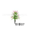 Decoración de mesa de arena de hierba de aguja al por mayor de fábrica, flores verdes, flores y plantas de plástico, modelo de planta tropical mini, simulación