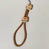 Cordão de Celular Desenho Animado Estojo para Fone de Ouvido Garrafa de Água Pen Drive Aquecedor de Mãos Mini Ventilador Pulseira de Pulso para Celular Anti-Perda para Celular