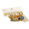 Aogu Europeos y Americanos Chapados en Oro de 18 Quilates Zirconia Goteo de Aceite Ojo del Diablo Acero de Titanio Pendientes para Mujer Set de Pendientes Elegantes de Nicho Nuevo