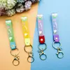 Llavero de accesorios de muñeca linda de cuerda de cuero de caucho suave pvc de arcoíris de deseo creativo accesorios de llavero para bolsa de pareja