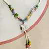 Collar con colgante de campana de mariposa de cerámica de estilo étnico retro para mujer, diseño nuevo y moderno, cadena larga para suéter, accesorios