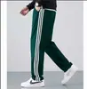 Pantalones Casuales a Rayas Estilo Hong Kong de Primavera y Verano para Hombre Estilo Coreano Moderno Combinable ins Sueltos de Pierna Recta y Ancha Pantalones Deportivos de Tres Barras