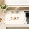 Alfombrilla de secado de dibujos animados de tierra de diatomeas, alfombrilla absorbente de agua anti-quemaduras estilo coreano para barra de cocina, posavasos para mesa de comedor, venta al por mayor de fabricante
