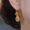 Nuevos Pendientes Clásicos Versátiles de Zirconia Color Café Granate Flor de Loto Tres Vidas Tres Adoraciones para Mujer, Pendientes Versátiles de Moda de Alta Gama