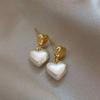 Pendientes de plata s925 con diseño de nicho de lujo, ligeros y con aguja, pendientes de perlas retro francesas avanzadas, pendientes de moda populares 2024