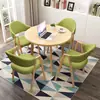 Conjunto de mesa e cadeiras para negociação loja comercial recepção reunião mesa redonda pequena área de descanso simples casual uma mesa quatro cadeiras mesa de jantar