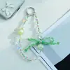 Nuevo accesorio de cadena para teléfono con lazo de cuentas de cristal de celebridad de internet, sección corta, colgante para teléfono, colgante anti-pérdida para teléfono, colgante para bolso