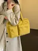 Nuevo modelo transfronterizo para otoño e invierno 2026, bolso de mano de gran capacidad, estilo coreano, color sólido, ligero, simple, casual, bolso de hombro versátil