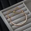 Oro Verdadero Galvanizado Micro-incrustado Zircón Elegante Joyería de Mano Diseño Nicho para Mujer Pulsera Ajustable de Tirar para Combinar con Todo Joyería de Mano