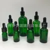 Botella de vidrio líquido oscuro para venta al por mayor 30 ml botella de aceite esencial verde gotero con cabeza de goma botella de esencia botella de aromaterapia