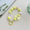 Cadena para teléfono móvil con cuentas, color caramelo fresco y chapado en color, con lazo de amor y pequeñas flores, colgante para funda de teléfono para mujer.