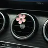 Aromaterapia para Coche Salida de Aire Acondicionado Decoraciones Decoración Perfume Suministros para el Interior del Coche Flores de Cinco Pétalos Cruz de Metal Transfronterizo
