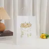Bolsa de Cartón Blanco Estampado en Caliente Bolso Estilo Sencillo Bolsa de Empaque Centro Comercial Bolsa de Compras Bolsa de Empaque Práctica Venta al Por Mayor
