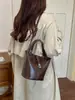 Bolso cubo de alta gama, diseño de nicho para mujer, nueva colección 2026, adecuado para el trabajo diario, se puede llevar como bolso cruzado, bolso de mano o bolso de hombro
