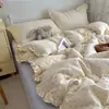 Juego de ropa de cama de cuatro piezas estilo coreano INS con lunares, borde de volantes de algodón puro, juego de tres piezas de doble capa de gasa de algodón para dormitorio de estudiante, Clase A