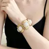 Nuevo brazalete de mujer con patrón martillado en relieve transfronterizo europeo y americano, incrustaciones de piedras preciosas, estilo de nicho exagerado con un toque de alta gama, venta al por mayor