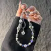 Elegante correa de cristal con cuentas para teléfono con colgante de girasol de circonita, cordón para teléfono, accesorio para muñeca y bolso, anti-pérdida