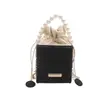 Bolso pequeño de alta gama 2026 nuevo estilo celebridad de internet elegante bolso cubo casual simple bandolera bolso pequeño bolso de mano de perlas