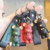 Llavero de Oso con Pajarita Creativa y Correa de Cuero Exquisito Regalo Colgante para Mochila Figura de Dibujos Animados Regalo de Jardín de Infancia