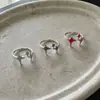 Anillo de estrella de esmalte asimétrico estilo minimalista ins coreano para mujer, nuevo anillo abierto versátil de estrella de cuatro puntas dulce y fresco