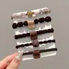 Nuevas diademas de alta gama 2026 para mujer, ligas de goma, cordones para el pelo, anillos para el pelo, cubiertas de cuero, accesorios para el pelo de niña con un toque de sofisticación