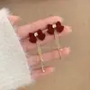 Pendientes de Borlas con Lazo Rojo 2026 Nuevo Estilo Caliente Lujo Ligero Gama Alta Pendientes de Año Nuevo Accesorios de Oreja Únicos de Nicho
