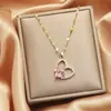 Collar de acero de titanio que no se decolora, diseño de nicho de lujo ligero, cadena para la clavícula versátil de alta gama para mujer, joyería de corazón y mariposa al por mayor