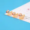 Muñeco de pato de dibujos animados amarillo luminoso adornos pequeños micro paisajismo resina joyería creativa manualidades accesorios