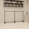 Estante de exhibición para tienda de ropa perchero negro para tiendas de ropa de mujer y niño estante de pie estante de arte de hierro isla de exhibición perchero para vestidos