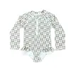 Traje de baño floral de una pieza para niña 2026 Nuevo estilo Traje de baño de manga larga con protección solar para bebé Traje de baño de playa para bebé