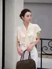Atacado transfronteiriço moda feminina item quente 2026 Estilo elegante francês gola V manga curta blusa top HBZWW919636