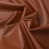 Tecido de couro PU impermeável amarelo com padrão de lichia, não elástico, resistente ao desgaste, adequado para roupas, corta-ventos e jaquetas, material de couro artificial