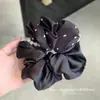 Selección PremiumElásticos elegantes y con estilo, nueva colección de accesorios para el cabello de nicho de alta gama para recoger el cabello en la parte posterior de la cabeza