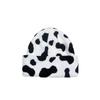 Moda europea y americana Invierno Sombrero de punto jacquard para mujer al aire libre sin ala cálido estampado de leopardo sombrero para el frío protección para las orejas engrosada sombrero de lana hombre
