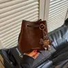 Cross2026 Otoño Nuevo Bolso Cubo Coreano para Mujer Moda Versátil Simple de Mano Retro Hombro Cruzado