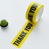 Fita de aviso com logo de marcação de decoração, cor de fundo amarelo, letras pretas, rolo grande, largura 4,8 cm, comprimento 25 metros