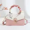 Bolsa Cuadrada Pequeña con Bordado de Flor Minimalista para Mujer 2026 Nueva Versátil Hebilla Bolso Cruzado Textura de Lujo Ligero Bolso de Mujer Transfronterizo