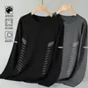 Camiseta casual versátil de manga comprida para outono para homens, gola redonda, cor sólida da moda, confortável, respirável e com caimento solto