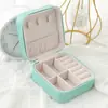 Joyero de almacenamiento simple transfronterizo de PU, venta al por mayor, caja de almacenamiento de joyas portátil creativa, caja de almacenamiento de pendientes, anillo, joyero pequeño