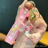 Colgante de Bolsa Sanrio Arena Movediza Kuromi Planeta Llavero Aceite Luminoso Perro de Orejas Grandes Bola de Cristal Pequeño Regalo